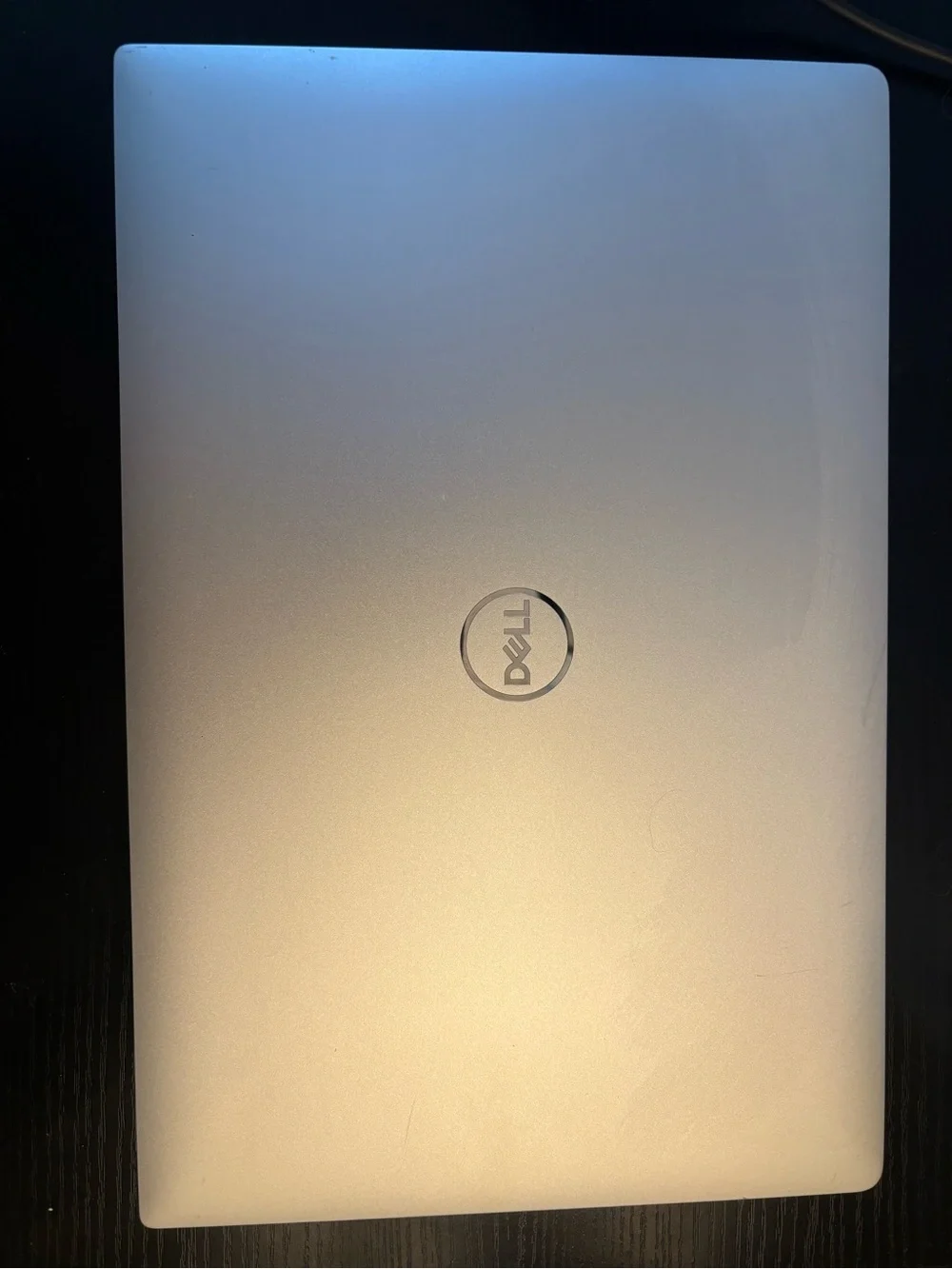 Dell Laptop with Black Chassis and Silver Keyboard Trim